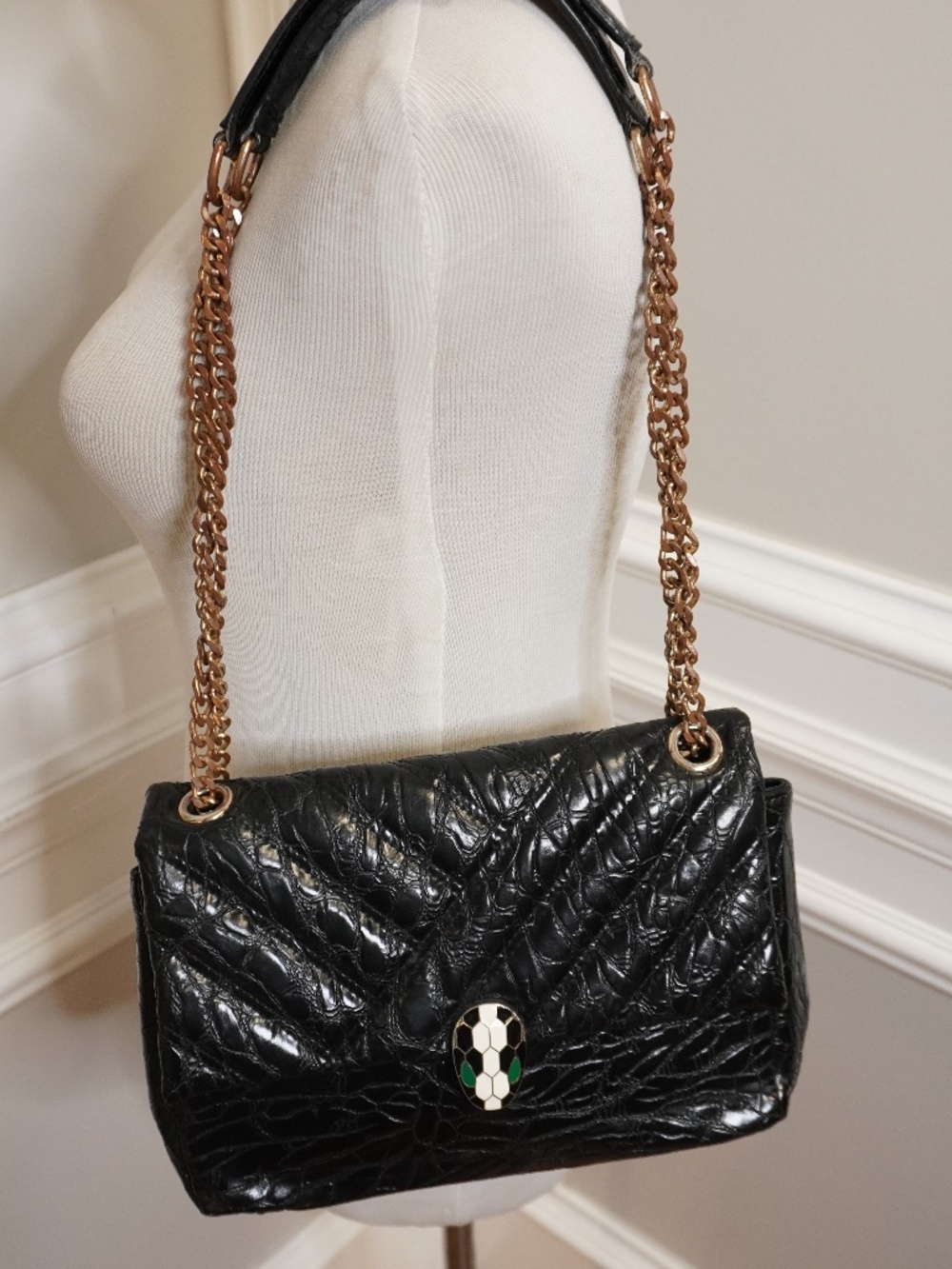 BVLGARI Serpenti shoulder bag features a distinctive snake head clasp